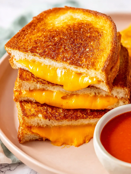 A stack of grilled cheese sandwiches.
