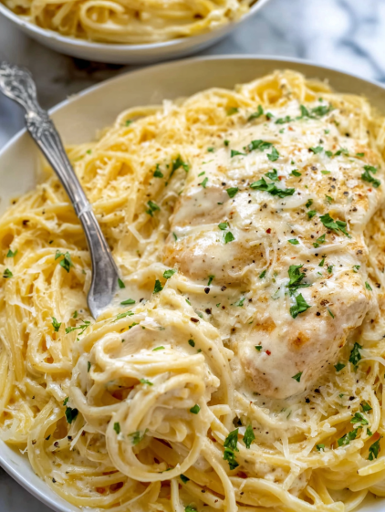 A bowl of food with a fork in it.