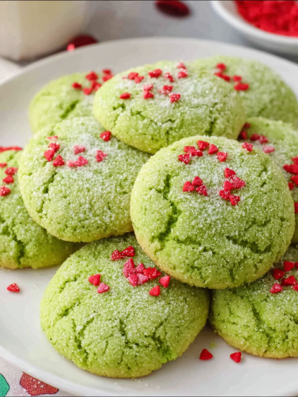 Grinch cookies on a plate.