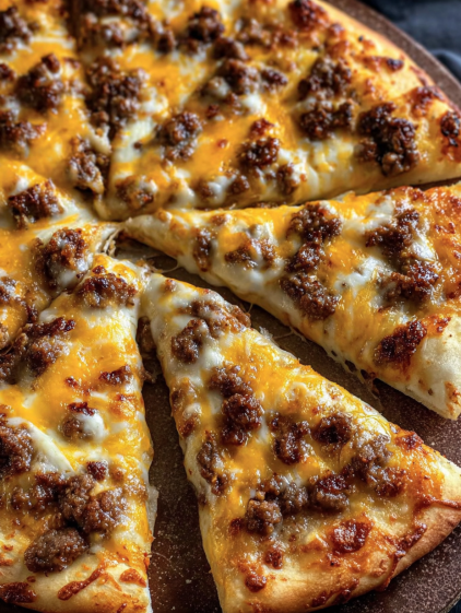 A slice of pizza on a plate.