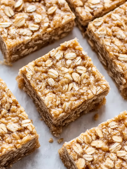 Baked oatmeal breakfast bars on a white plate.