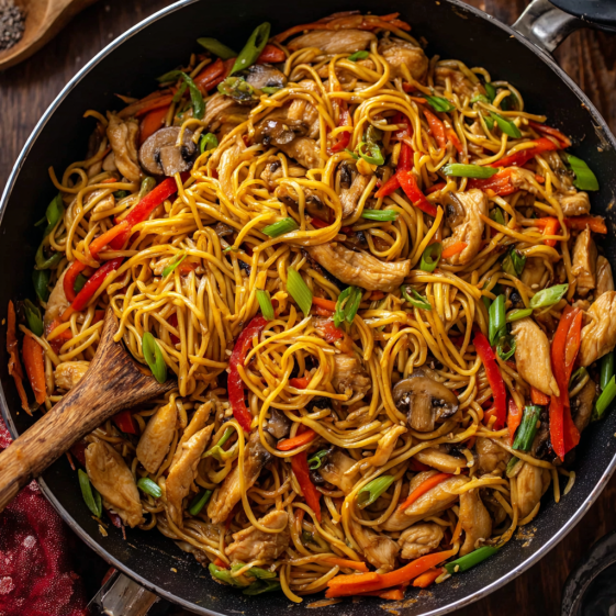 A delicious Asian dish with chicken, noodles, and vegetables.
