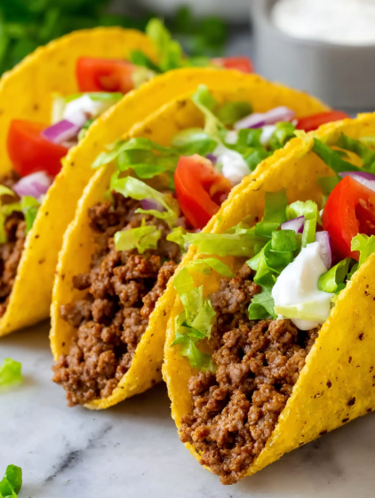 A plate of tacos with meat and vegetables.
