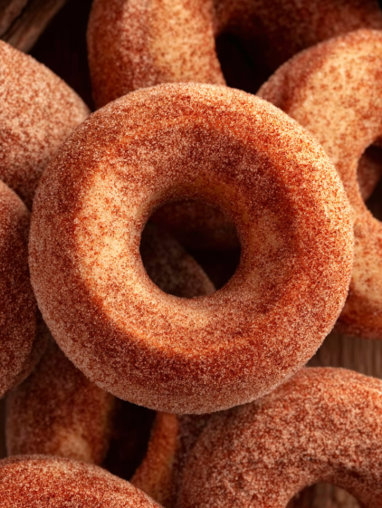 A donut with a hole in the center.