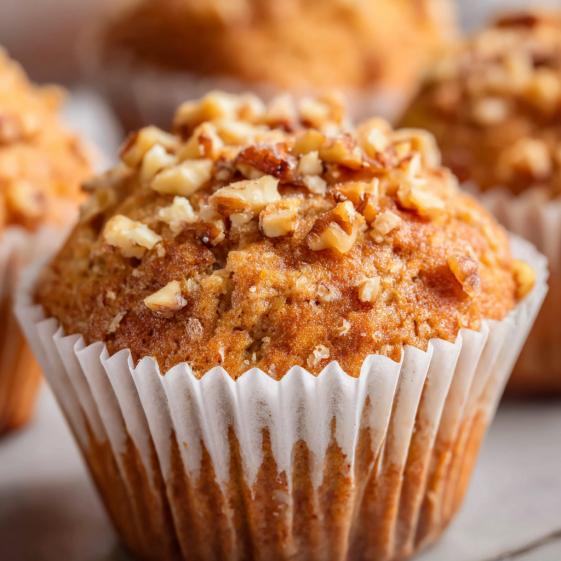 A muffin with nuts on top.