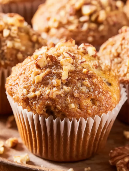 A cupcake with nuts on top.