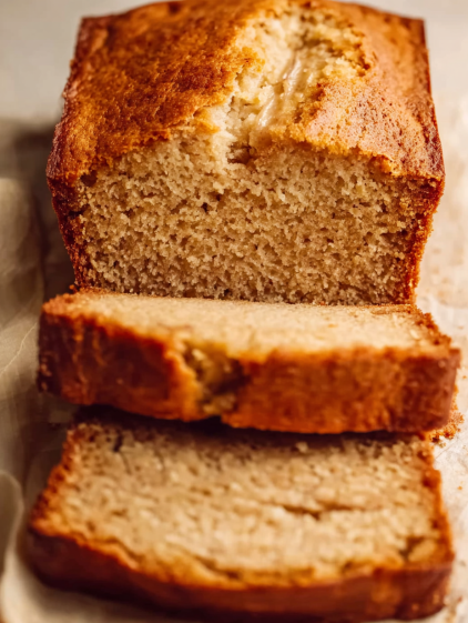 A slice of bread with a bite taken out of it.