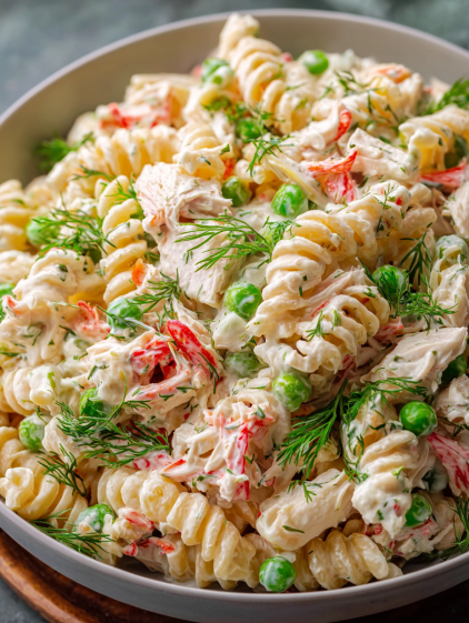 A bowl of crab pasta salad.