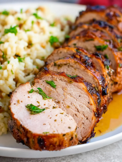 A piece of meat is on a plate.
