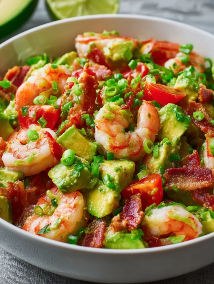 A bowl of shrimp and avocado salad.