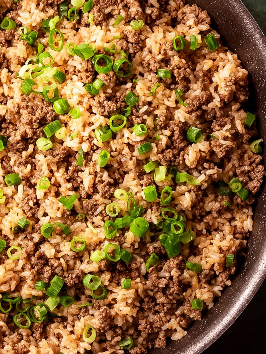 A bowl of rice with green onions.