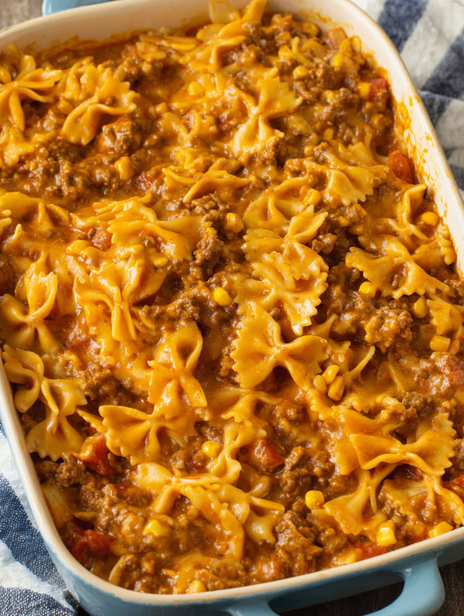 A bowl of pasta with meat sauce.
