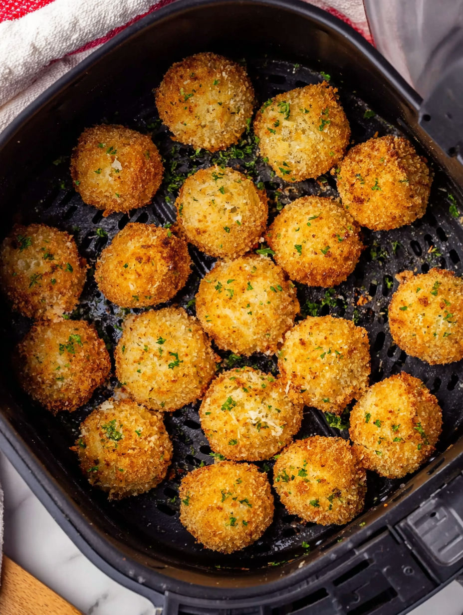 A pan of food with a green herb on top.