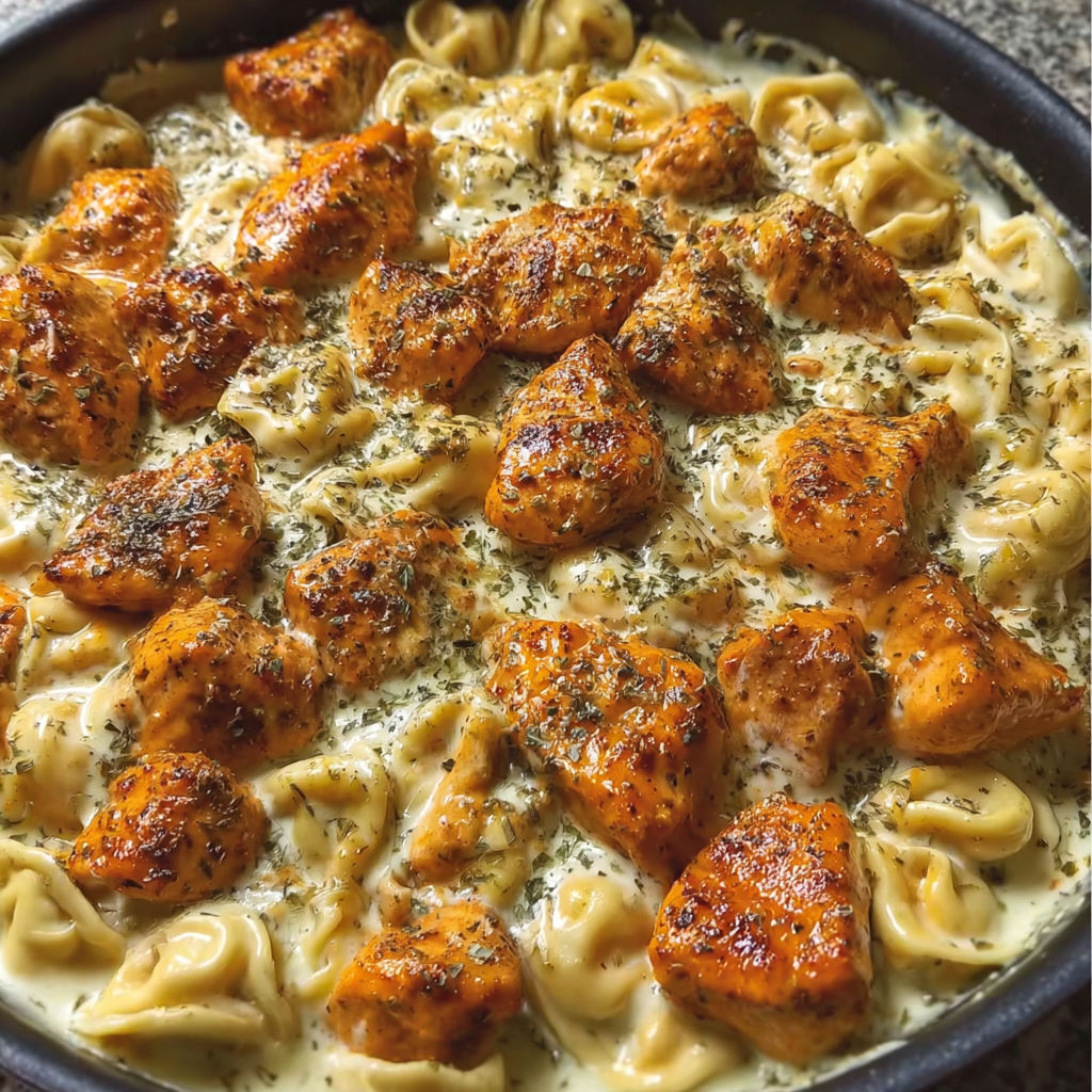 A dish of buffalo chicken tortellini alfredo.