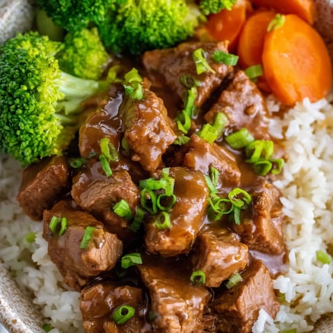 A bowl of beef tips and gravy.